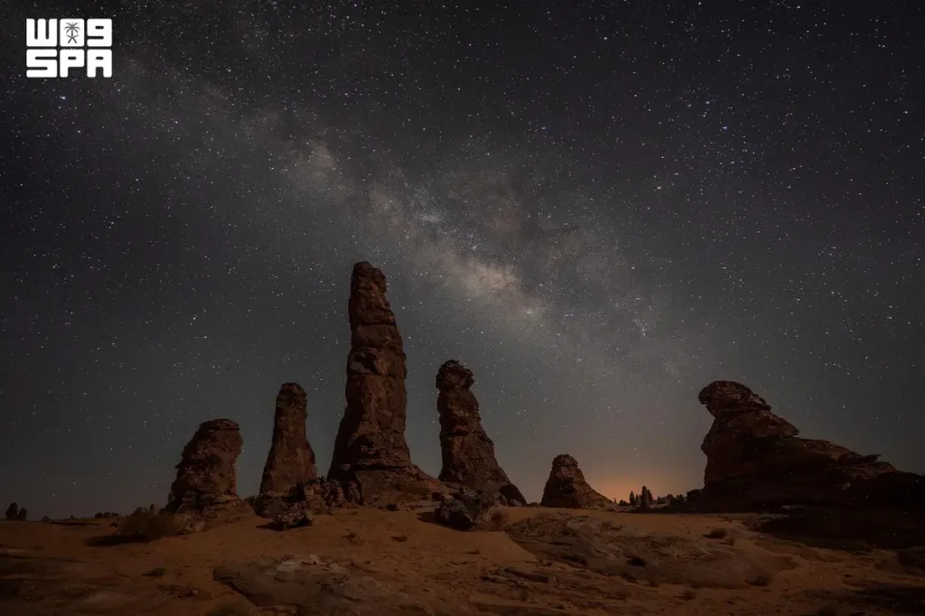 Star-filled night sky above AlUla rock formations